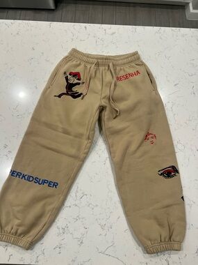 KIDSUPER Resenha Tan Graphic Joggers for Men
